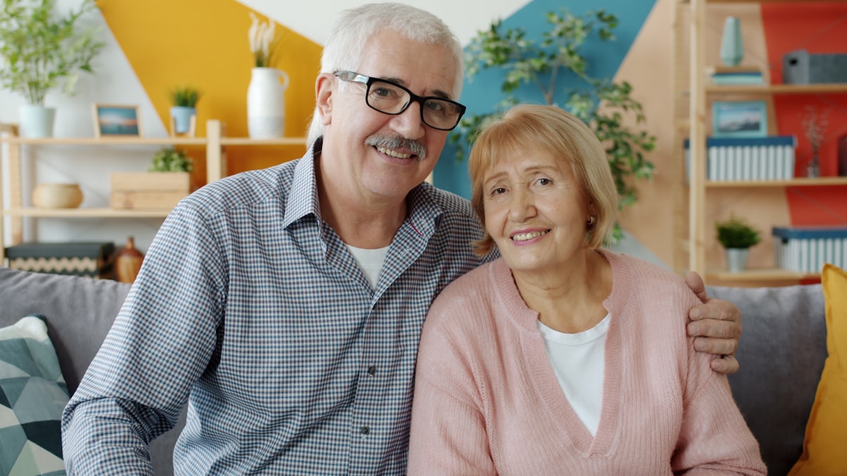 Healthcare professional discussing vitamin benefits with mature client